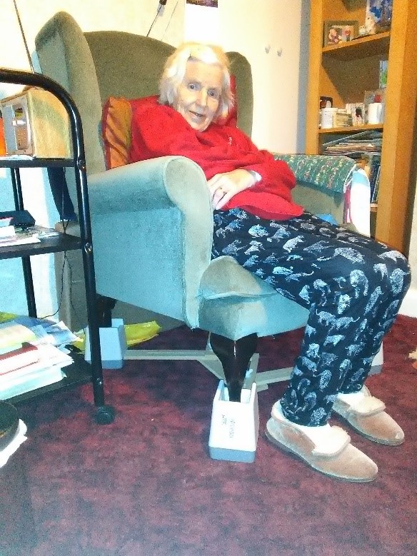 Photo of mum in chair in bungalow