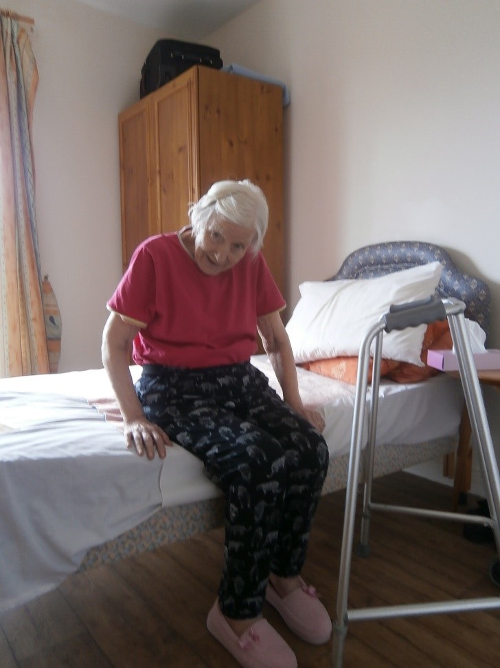 Photo of mum sat on bed