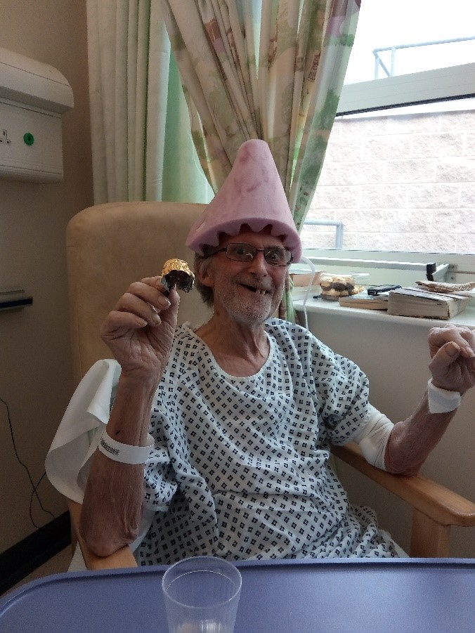 Photo of dad with a cone on his head - in hospital