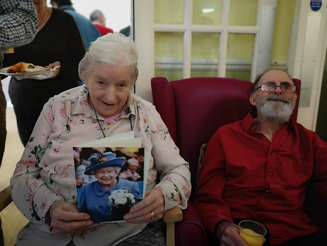 Photo of mum with Queen’s card plus dad