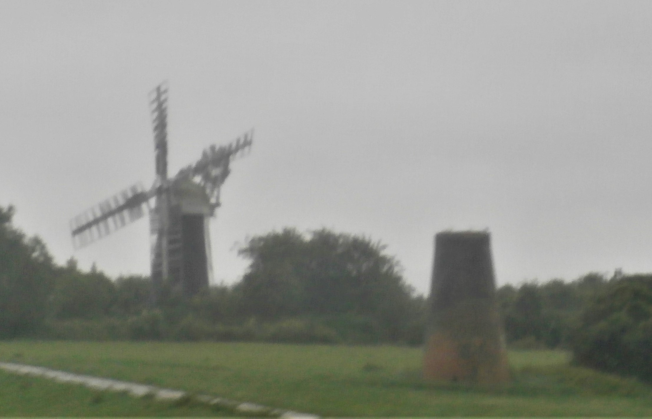 Photo of damp view between Great Yarmouth and Berney Arms - windmill
