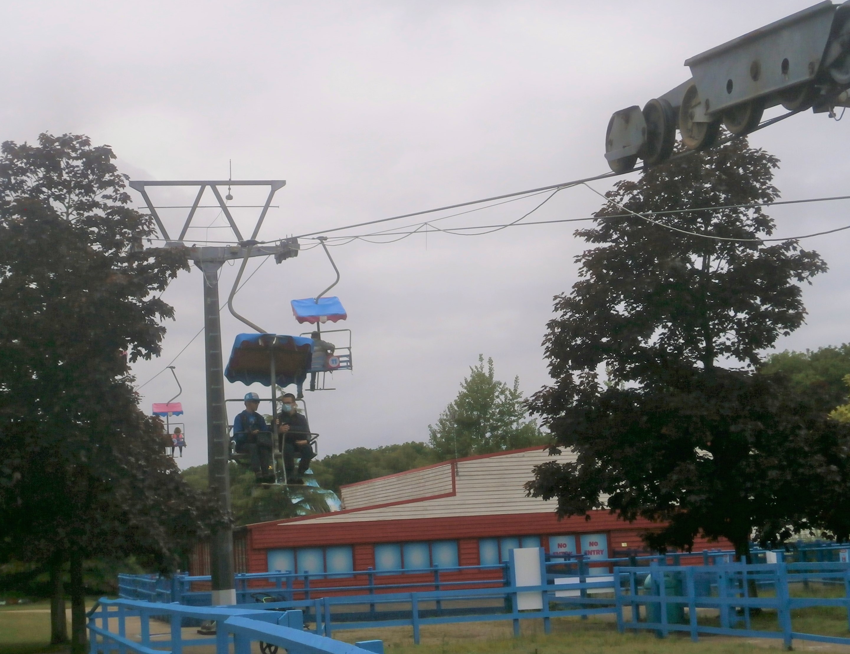 Photo of Phil and Luke on chairlift at Pleasurewood Hills
