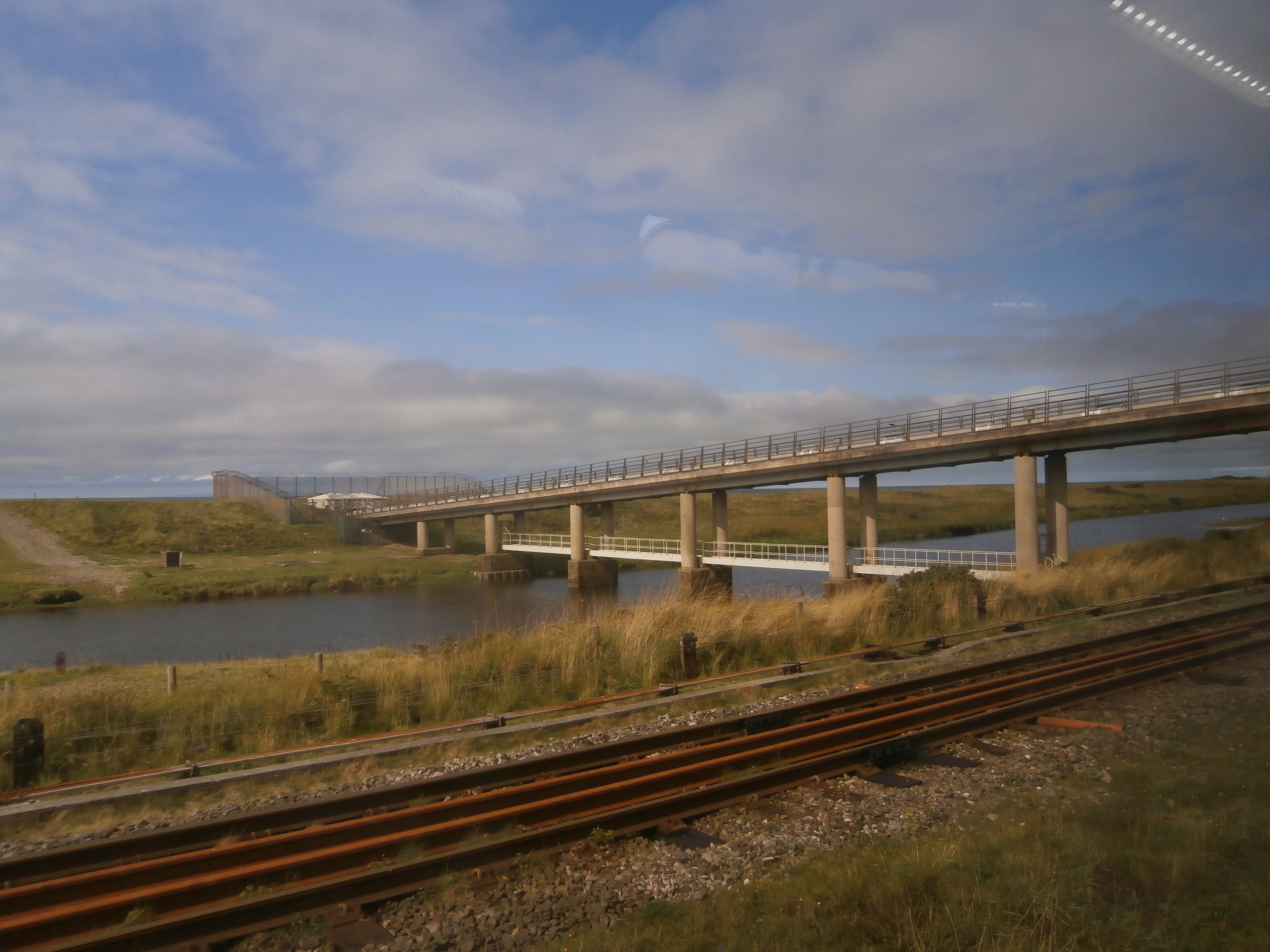 Photo of bridges over river near Cumbrian coast