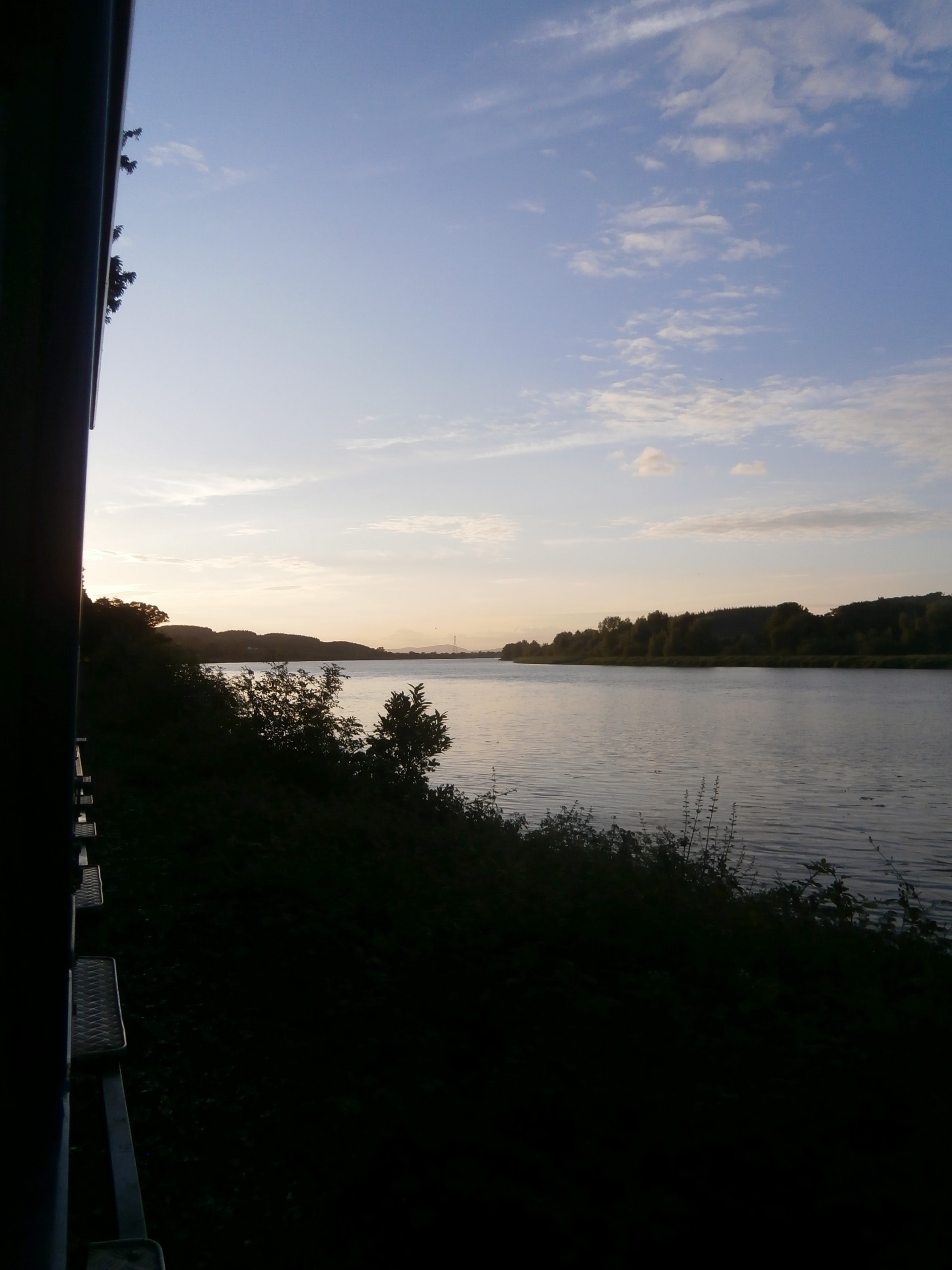 Photo of the sunset over the river from the Sunset Express on the Waterford and Suir Valley Railway