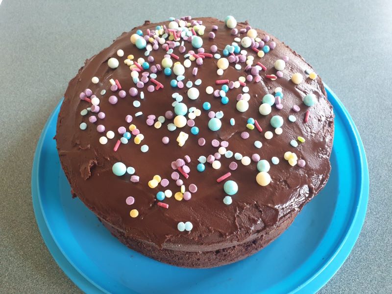 Photo of chocolate cake with sprinkles