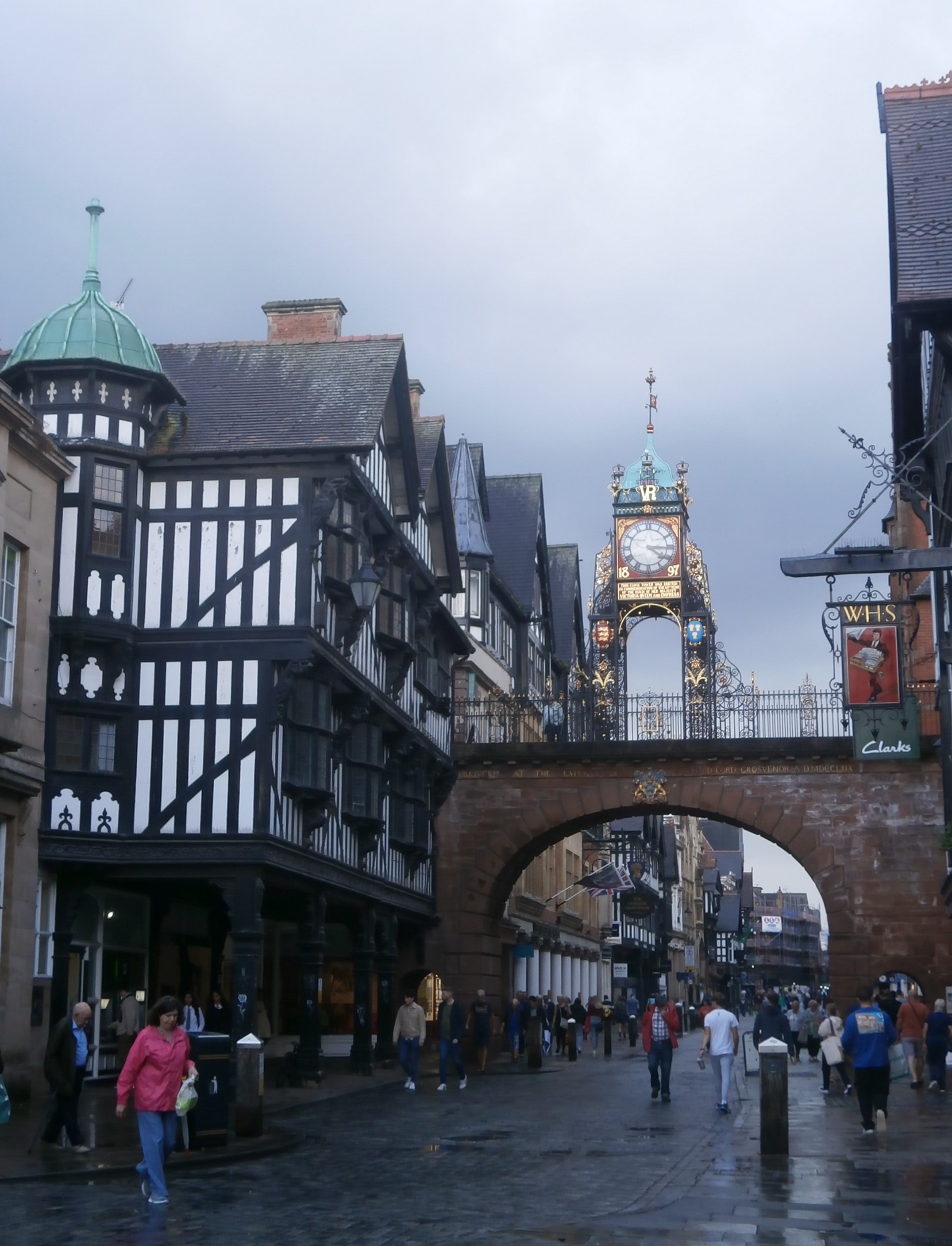 Photo of clock and Tudor building in the centre of Chester