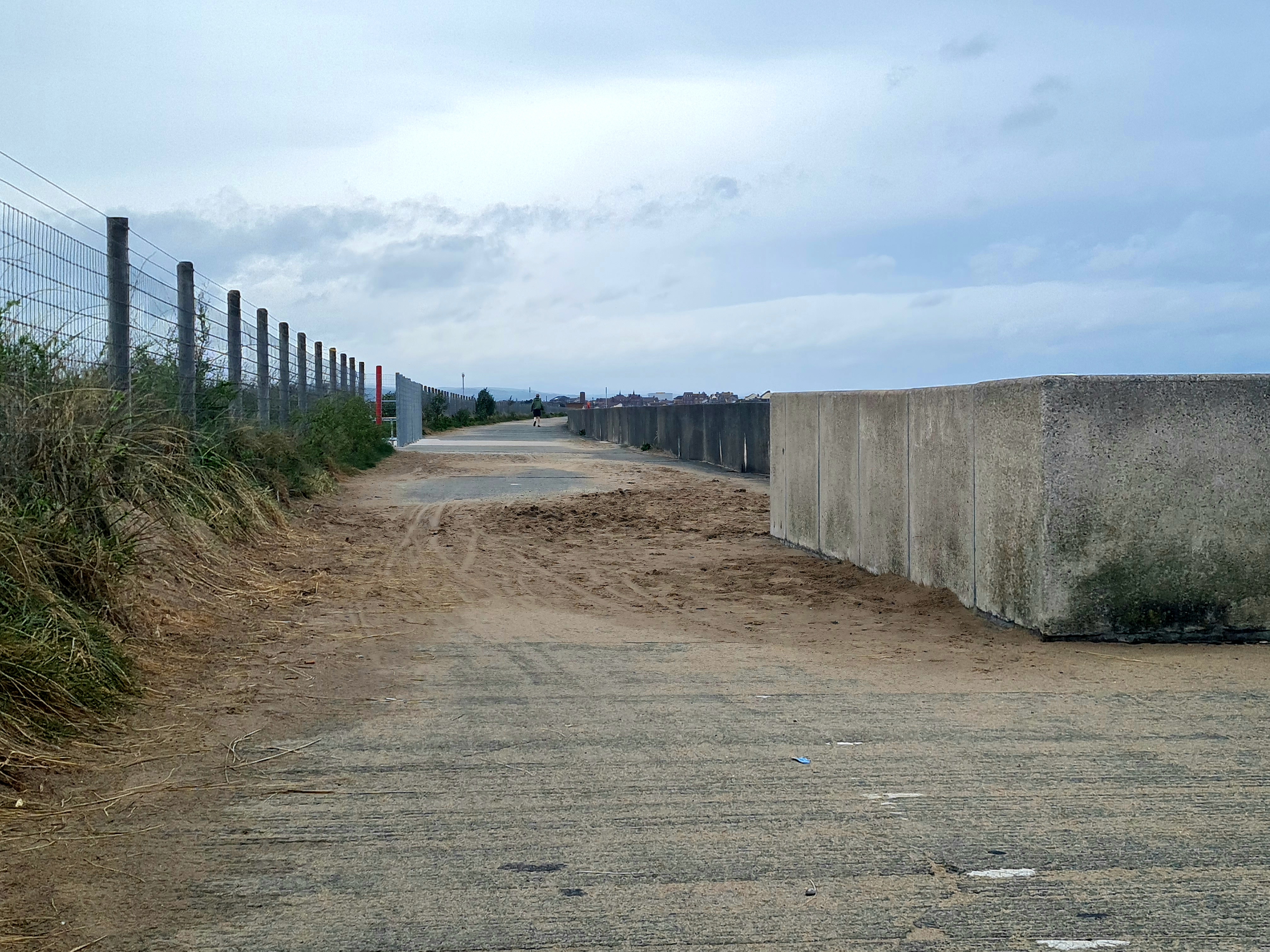 Photo of Sand across North Wales coastal path between Rhyl and Prestatyn